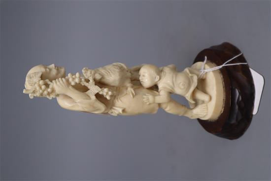 A Japanese ivory okimono group of a gentleman, a cockerel and a young boy, overall height 20cm